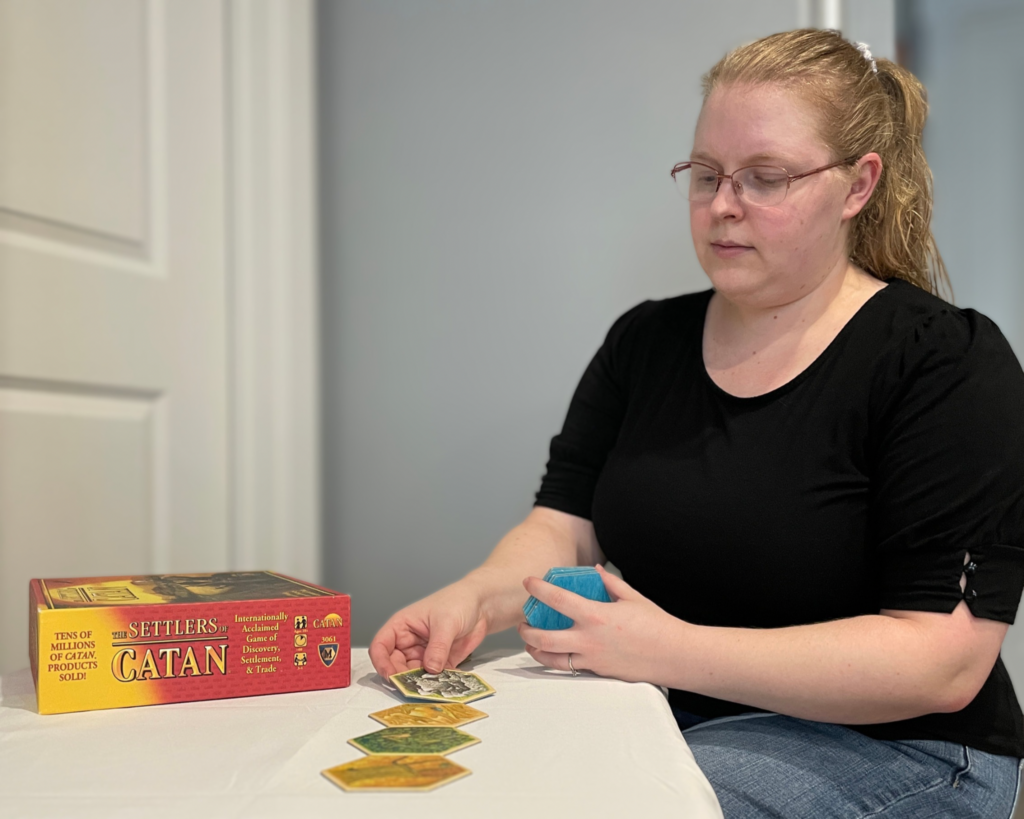Image of author laying out a board for a game