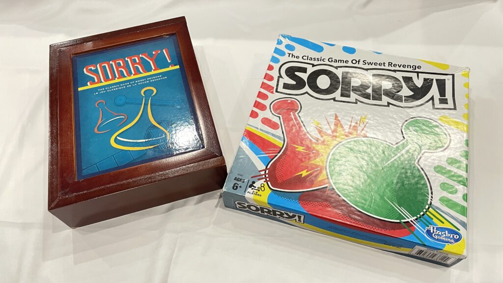 An image of two different Sorry board game boxes.